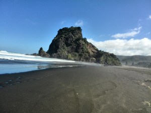 Lion Rock and black sand at Piha Beach, Auckland